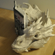 Illustration for article titled Artist Turns emThe Hobbit/em Book Into Paper Sculpture Of Smaug